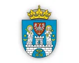 Herb z koroną, orłem i świętymi. Symbol poznania i władzy, z kluczami u podstawy.