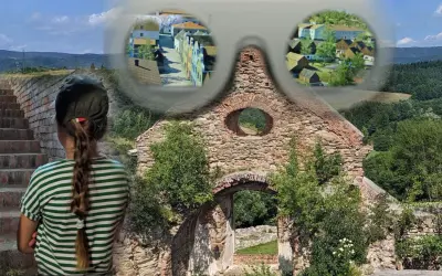 Dziewczynka patrzy na ruiny, wyobrażając sobie dawne osieczna atrakcje. Widok na historyczne budynki i krajobraz.